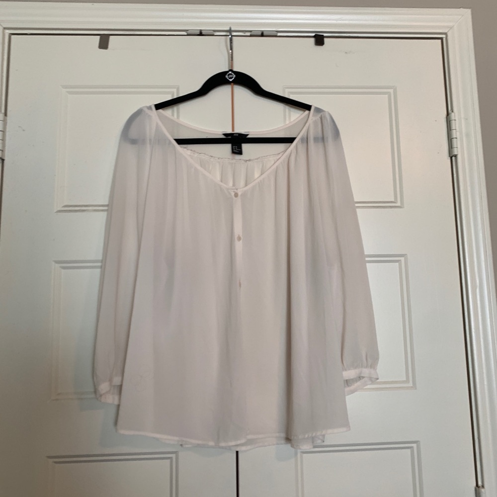 Blush three quarter sleeved blouse with buttons.